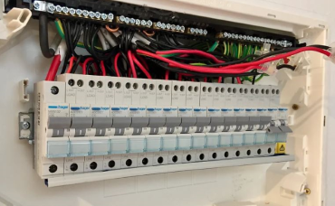 Electrician performing a Switchboard upgrade and repair